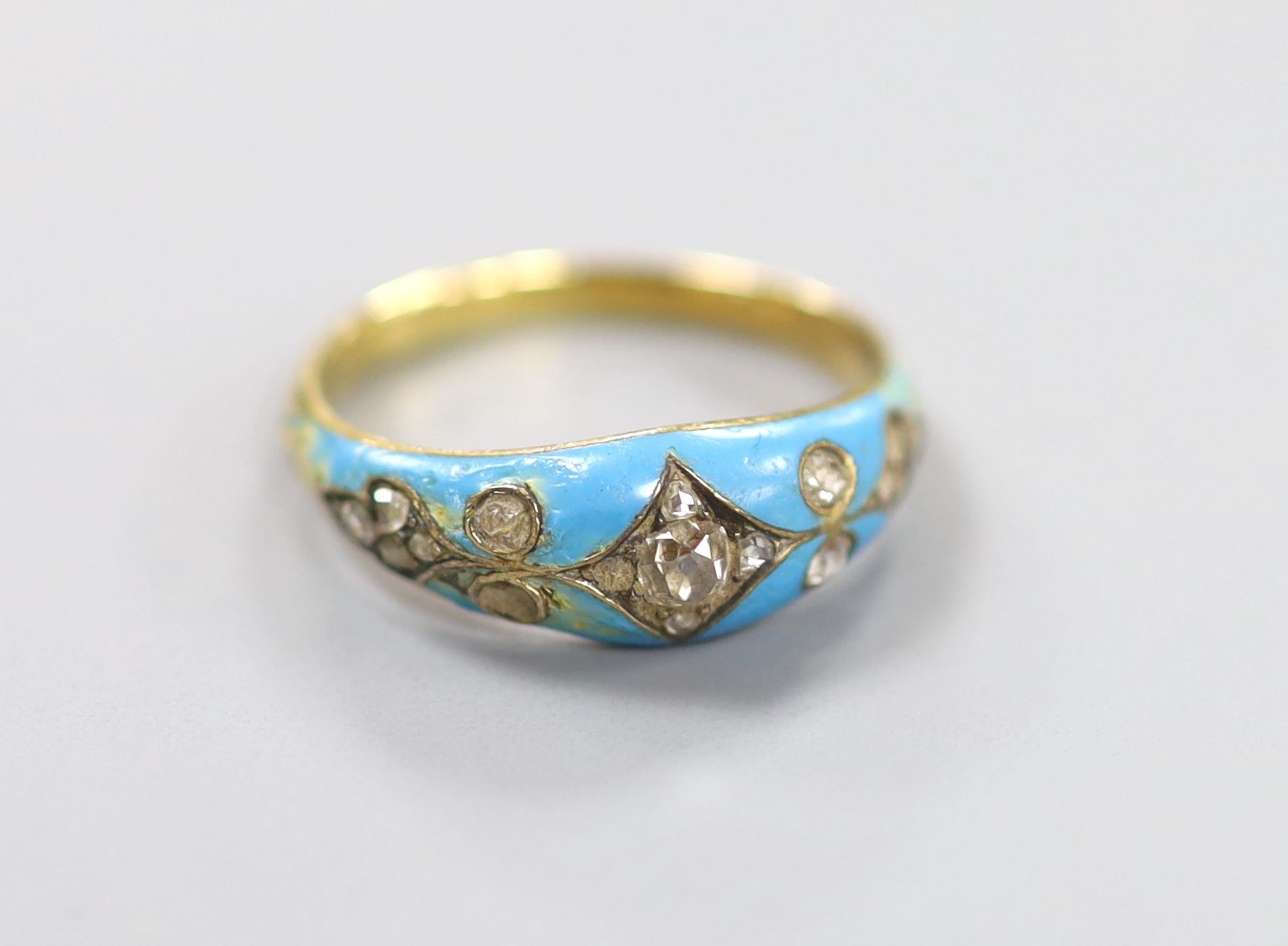 A late Victorian yellow metal, enamel and rose cut diamond set dress ring(a.f.), size L/M, gross weight 4.9 grams.
